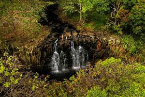 Rochester Falls On The Island Of Mauritius.Waterfall in the jungle of the tropical island of Mauritius photo