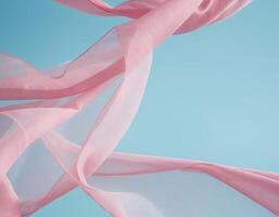 Flying pink fabric wave on blue background, flowing waving silk fluttering cloth photo