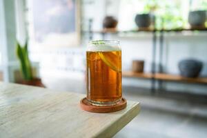 Fresh cold lemon tea on a table in an elegant cafe photo