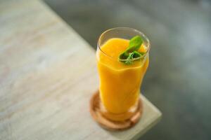 fresh mango juice on the table photo