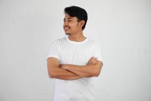 smile or happy asian man crossed arms wearing white t shirt isolated on white background photo