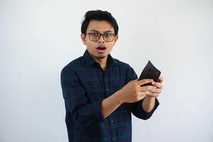 young asian man open his wallet and showing excited expression isolated on white background. photo