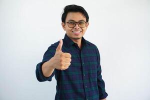 young asian man smiling happy at the camera and give thumb up isolated on white background. photo