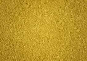 Abstract gold uneven texture background of foil, paper, canvas, wall, brush, fibre, or paint. Realistic gold abstract background. Artistic gold abstract background. Available for background texture. photo