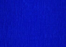 Elegant blue uneven texture background of foil, paper, canvas, wall, brush, fibre, or paint. Realistic blue abstract background. Artistic blue abstract background. For blue background texture. photo