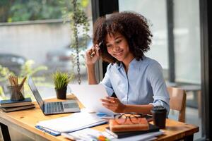 black woman working hard, work happily, The plan is going well, interesting story, consider the plan, come up with ideas, analyze situations photo