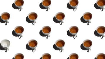 Pattern with lonely empty cup and many cups of tea animated on wite background. Tea mugs move in different directions. 4K video