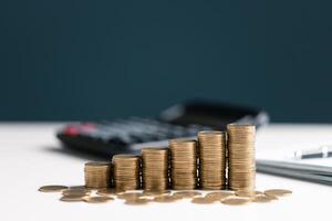 Woman with coin stack. Financial Growing savings concept. Saving money by hand putting coins money accounting planning. photo