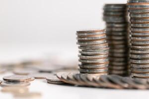 Stacked coins on white background. Investment concept photo