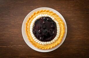 Blueberry Cheese Pie on white plate photo