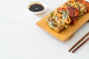 Pajeon or Korean pancake and Korean Kimchi pancake or Kimchijeon on white background photo