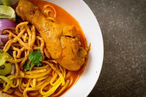 Northern Thai noodle curry soup with chicken photo