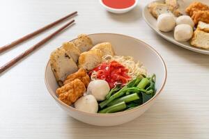 egg noodles with fish balls and shrimp balls in pink sauce, Yen Ta Four or Yen Ta Fo photo