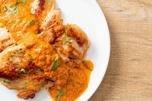 grilled chicken steak with red curry sauce photo