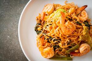 Stir-fried instant noodles sukiyaki with shrimps photo