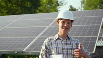 Engineer checks solar panels productivity. Alternative energy concept video