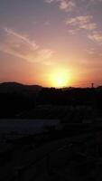 Vertical Video of Construction Crane at Sunset Aerial View