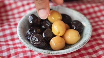 Collection of black and green olives with leaves. video