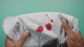blood stains on a white shirt. video