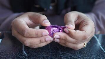 women hand removing cover from a chocolate ., video