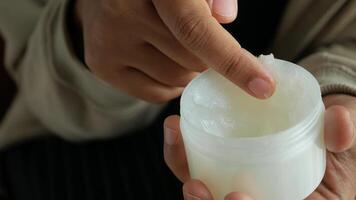 Close up of man hand using petroleum jelly video