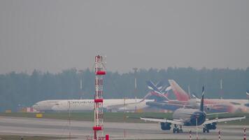 MOSCOW, RUSSIAN FEDERATION - JULY 30, 2021. Airbus A320 Aeroflot braking after landing, rear view. Passenger plane arriving. Tourism and travel concept video