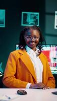 Vertical Video Portrait of hardworking dedicated girl attending online classes and webinars, improving her education and acquiring new academic skills. Smiling student taking career courses at home. Camera B.