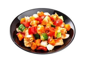 Asian salad - chicken with vegetables in spicy sauce isolated on white background photo