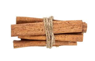 Cinnamon sticks bunch isolated on white background with clipping path photo