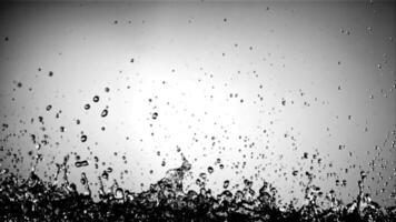 Splashes of water fly up and fall down. On a blue background. Filmed on a high-speed camera at 1000 fps. video