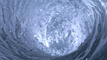 Super slow motion of water in a whirlpool. High quality FullHD footage video