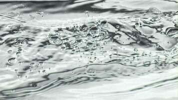 Air bubbles rise to the surface of the water. Macro background. Filmed on a high-speed camera at 1000 fps. High quality FullHD footage video