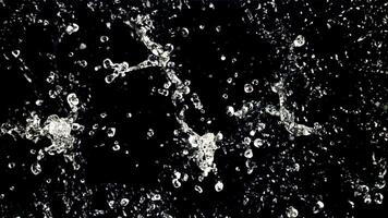 The movement of water in flight. Top view. On a black background. Filmed is slow motion 1000 fps. video