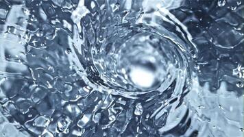 A whirlpool of water with air bubbles. Top view. Macro background.Filmed is slow motion 1000 fps. video