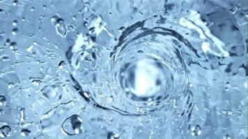 A whirlpool of water with air bubbles. Top view. Macro background.Filmed is slow motion 1000 fps. video