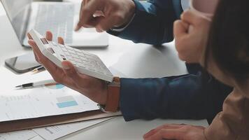 Finance manager meeting discussing company growth project success financial statistics, professional investor working start up project for strategy plan with document, laptop and digital tablet. video