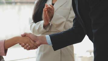 Business handshake for teamwork of business merger and acquisition,successful negotiate,hand shake,two businessman shake hand with partner to celebration partnership and business deal concept video