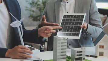 Solar panel green or renewable energy business concept, Group of business people meeting on solar cell panel technology and planning together video