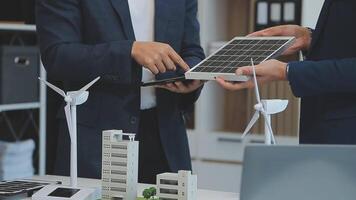 Solar panel green or renewable energy business concept, Group of business people meeting on solar cell panel technology and planning together video