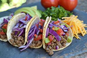 AI generated Mexican tacos with beef, tomatoes, onions and others on white background photo