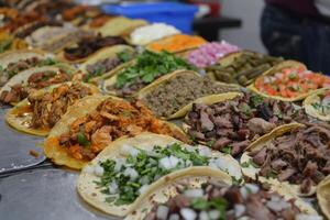 AI generated Mexican tacos with beef, tomatoes, onions and others on white background photo