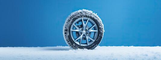 ai generado marca nuevo invierno coche llantas exhibido en contra un Nevado azul fondo, invierno llantas Listo para invierno foto