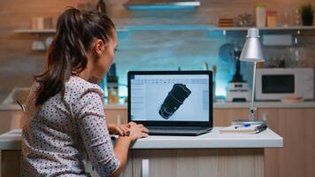 Designer engineer analizing new prototype of 3D model of the plant working from home. Industrial female worker studying turbine idea on personal computer showing cad software on device display photo