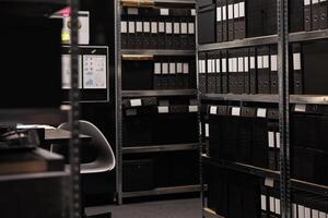 Empty detective space equipped with metallic storage full with criminal cases documents. Arhive room in police station is a secure location where crime evidence is stored during investigation photo