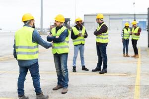 Industrial engineers working in logistic terminal of container cargo photo