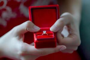 AI generated diamond ring in red box in woman hand on . ai generative photo