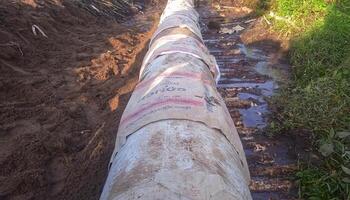 Laying sewer Concrete drainage pipe photo