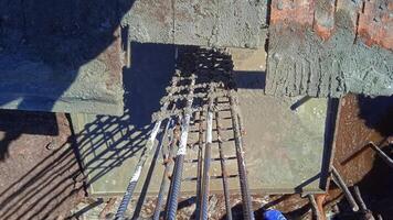 Aerial view of columnar structure reinforcement at construction site photo