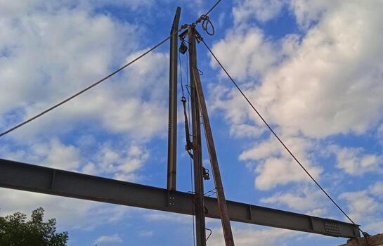 Structure of steel for building construction on sky background. photo