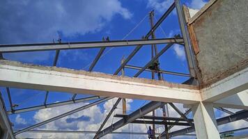 Structure of steel for building construction on sky background. photo